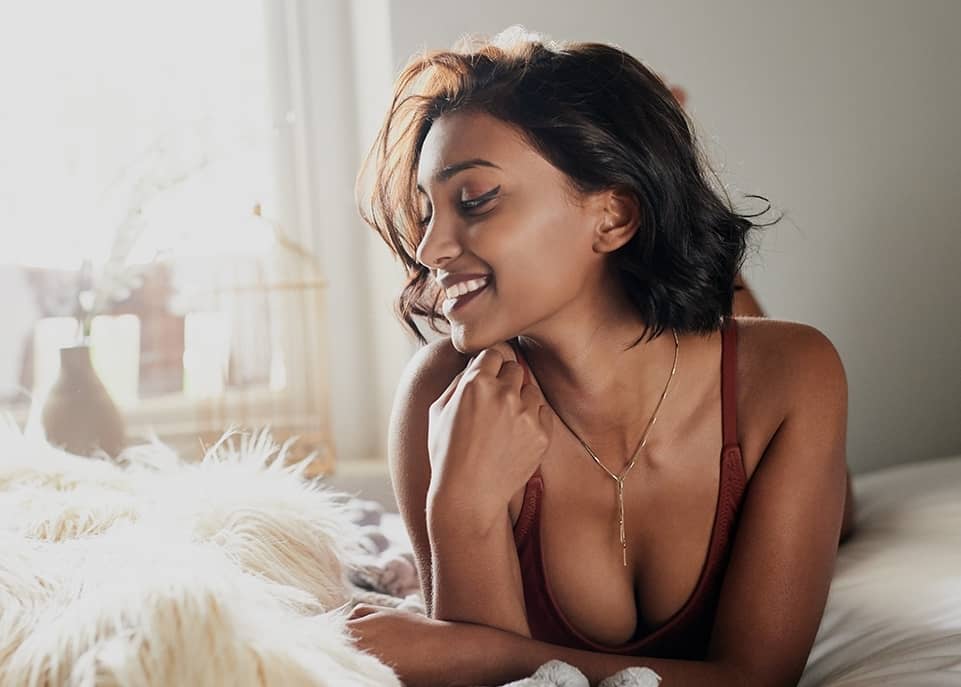 Woman laying on the bed looking to her right